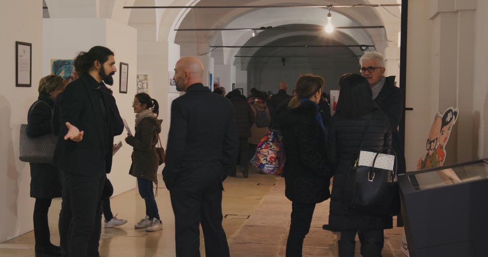 6 - People standing at annual exhibition accademia arte