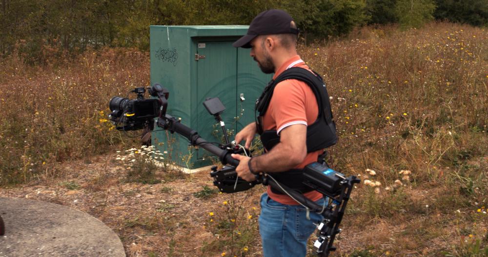 1 - camera operator wearing a thanospro 2 with a BMPCC4K